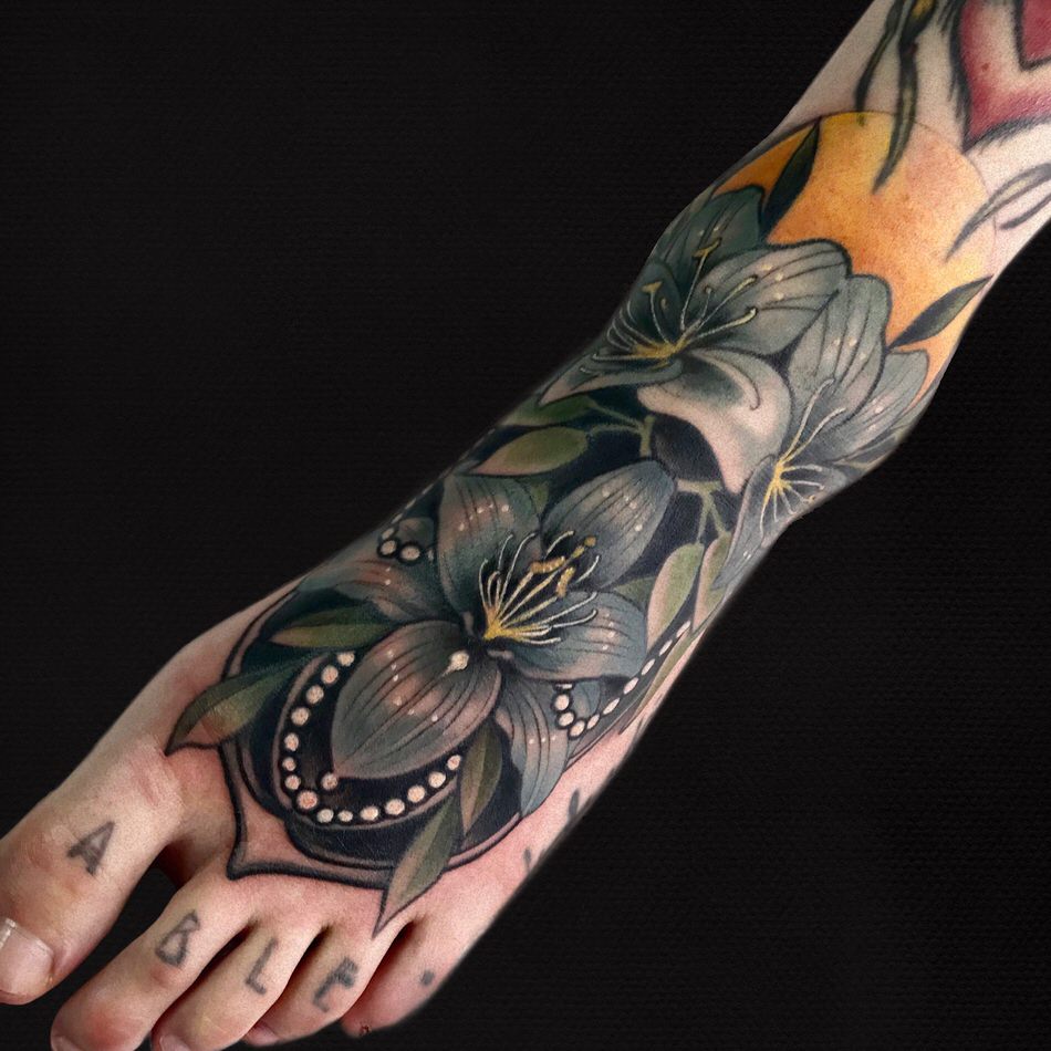 NEOTRADITIONAL LILIES TATTOO ON THE FOOT